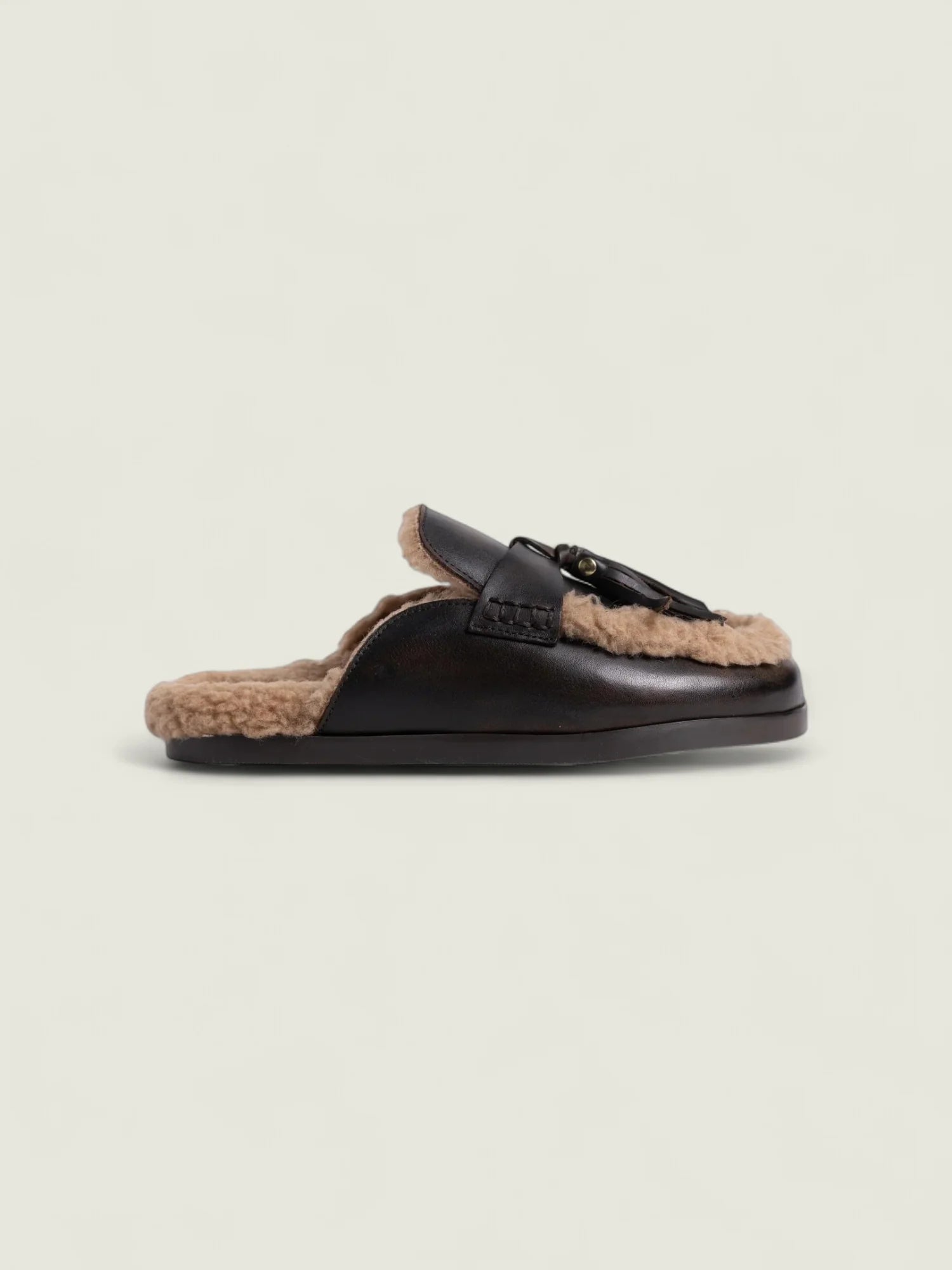 Mules en cuir fourrées